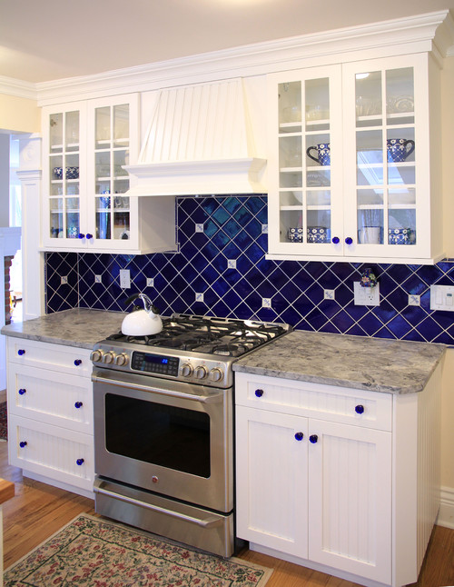 Cobalt Blue Hand Made Backsplash with White Fantasy Granite Countertop and White Glass Door Cabinets